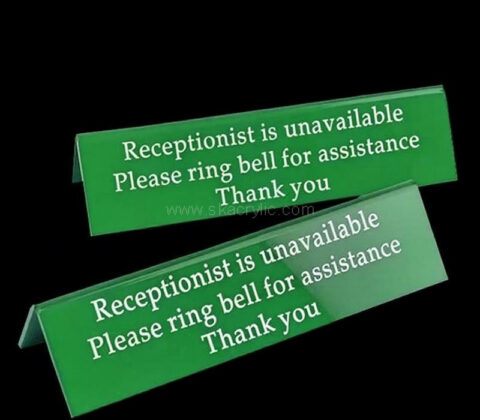 Custom acrylic sign on clinics reception desks